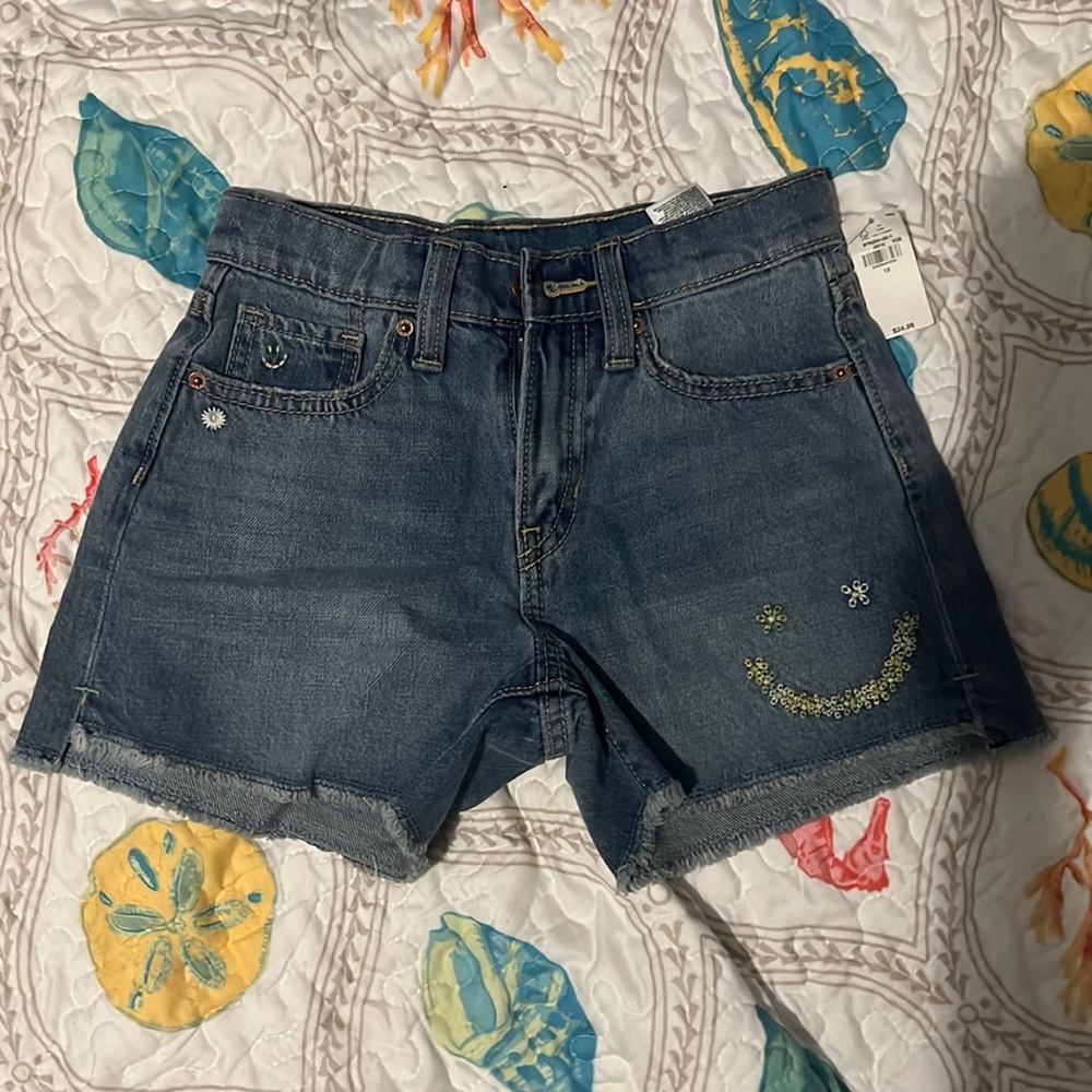 Cute floral, smiley face, denim shorts.